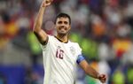 Rodri en action avec Manchester City sur un terrain de football.