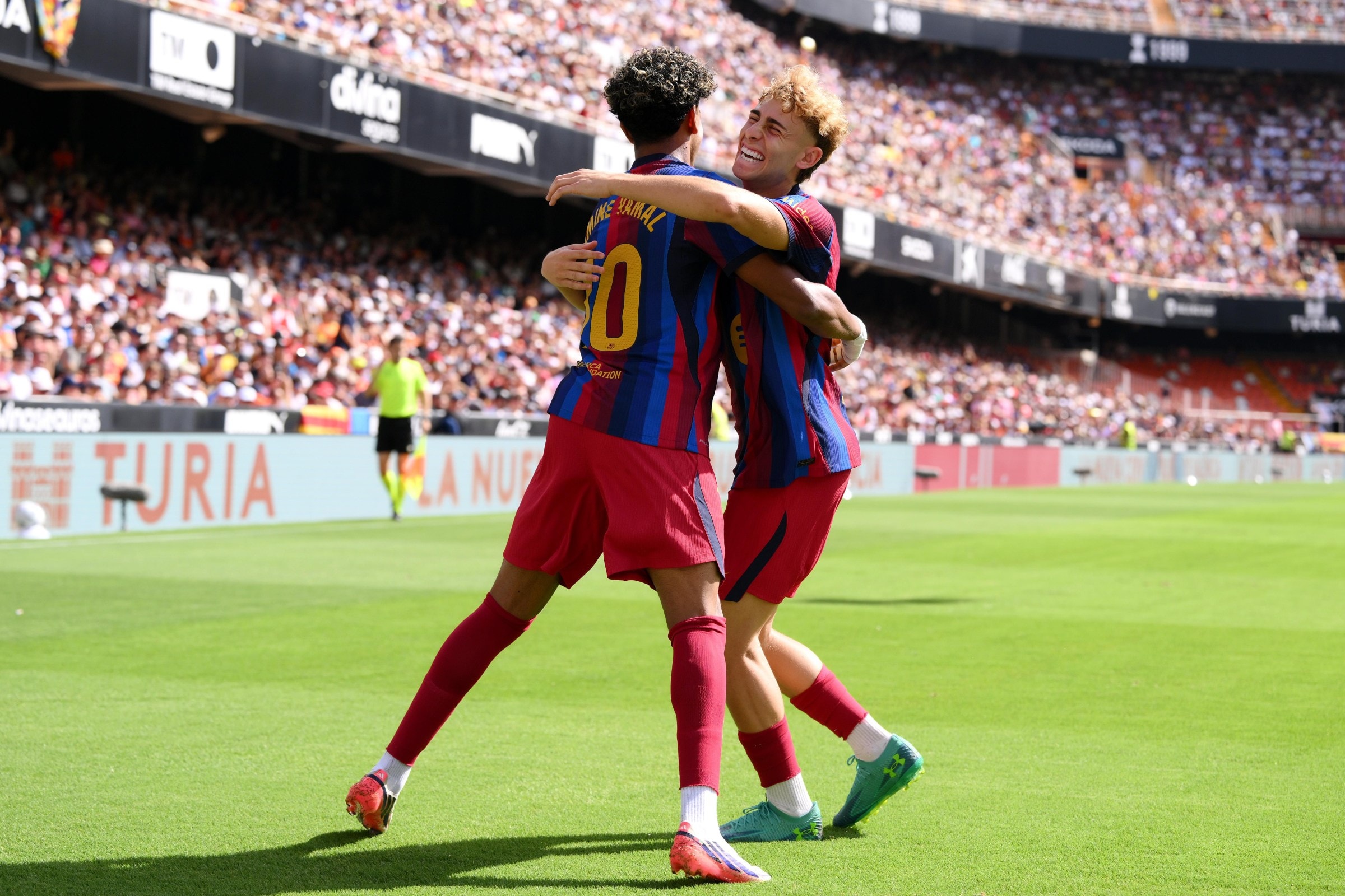 VALENCIA, SPAIN - SEPTEMBER 06: Lamine Yamal of Barcelona celebrates scoring his team’s first goal with teammate Fermin Lopez during the LaLiga EA Sports 2026/27 match between Valencia CF and FC Barcelona at Estadi de Mestalla on September 06, 2026 in Valencia, Spain. (Photo by David Ramos/Getty Images)