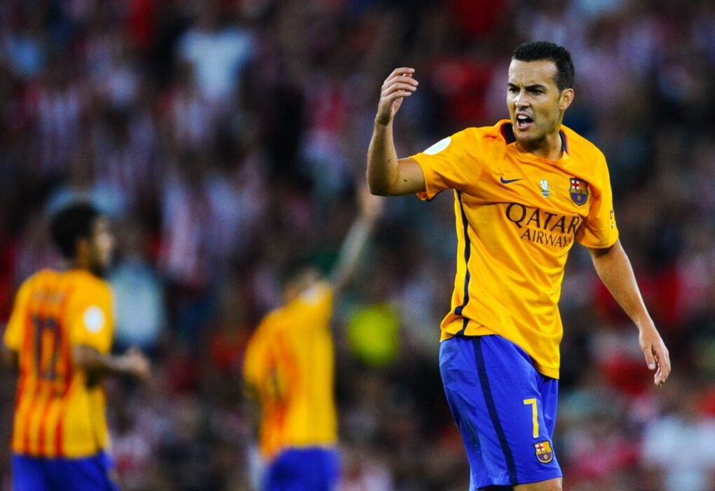 Pedro Rodríguez lors de sa cérémonie d'adieux au Camp Nou, aux côtés de Xavi et Joan Laporta.
